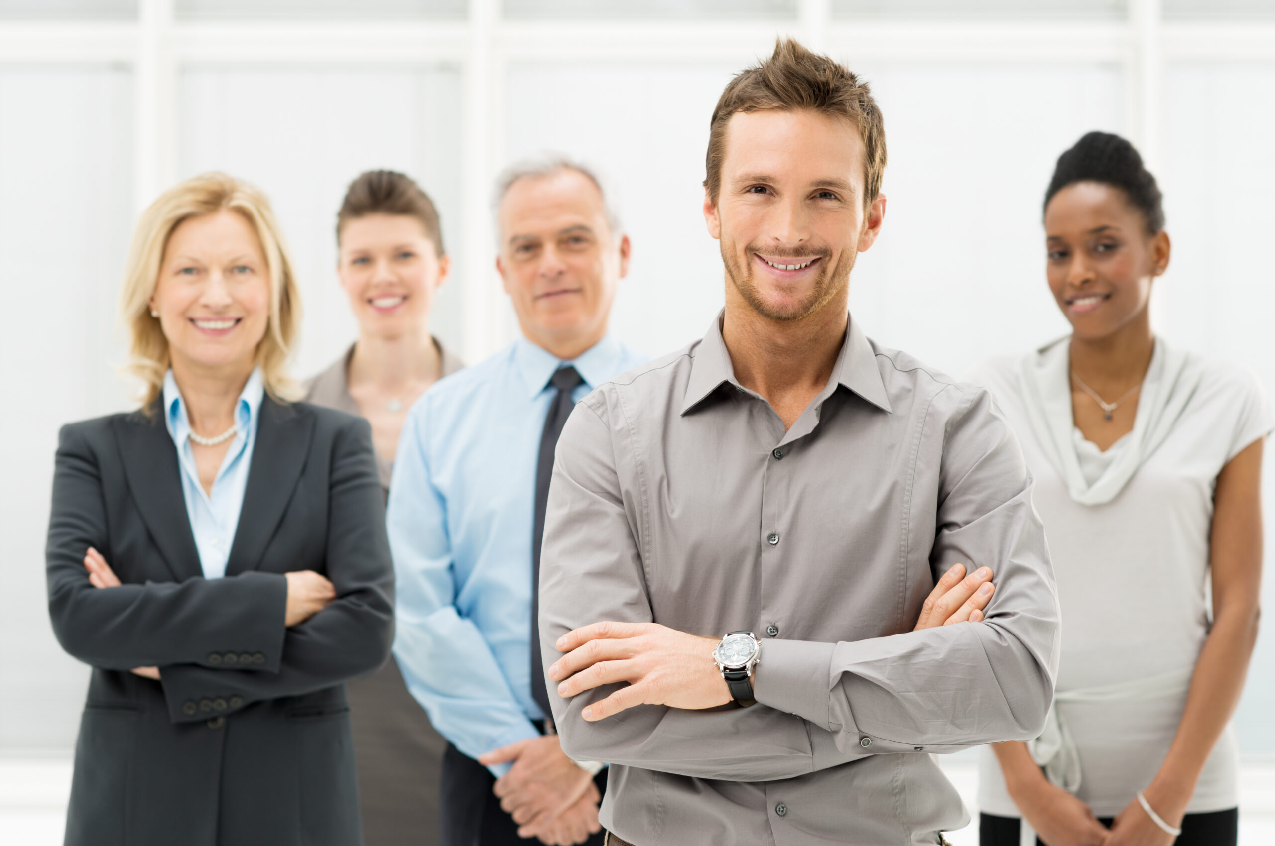 Portrait,Of,Young,Businessman,With,Business,Team
